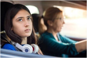 Mom in car with teen girl